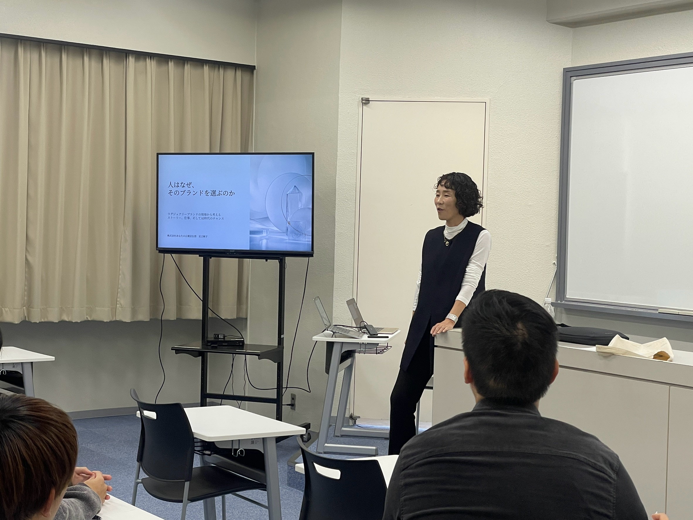 Junko Adachi delivering a guest lecture on marketing and branding at Osaka Gakuin University in Japan